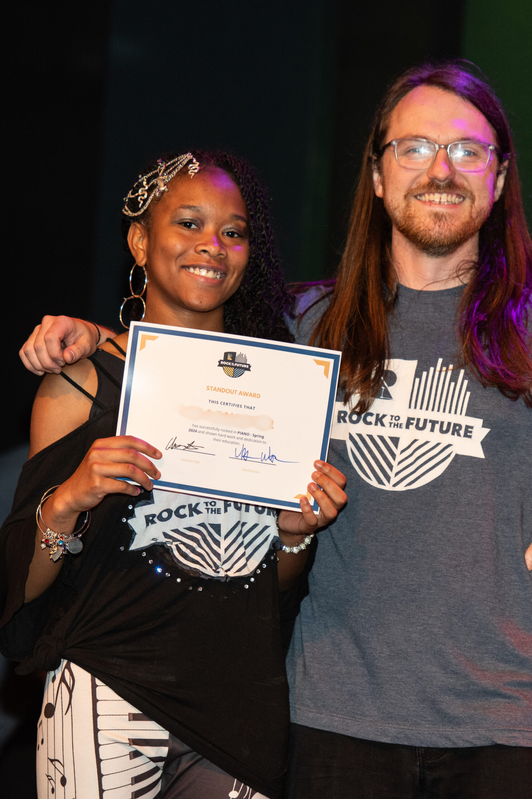 Rock to the future student receives award at their Year End SHowcase at World Cafe Live