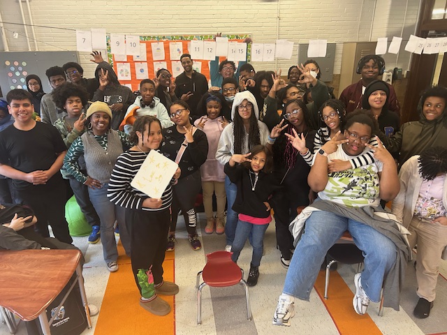 Rock to the Future students pose for a photo after a workshop with Ken Peeples.